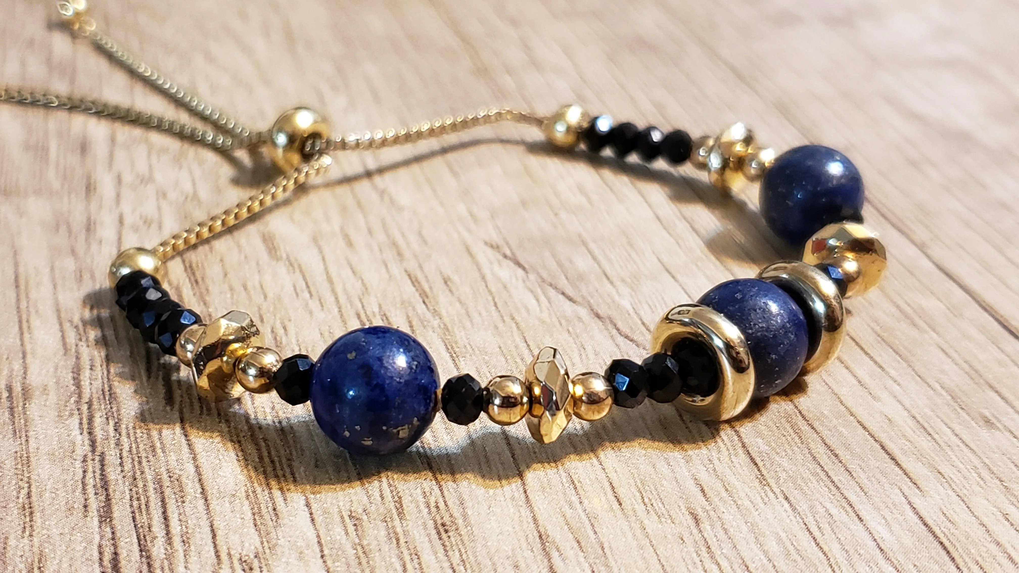 Hand Crafted Lapis Lazuli on 14k Yellow Gold Ion Plated Stainless Steel Bolo Style Bracelet, Adjustable.