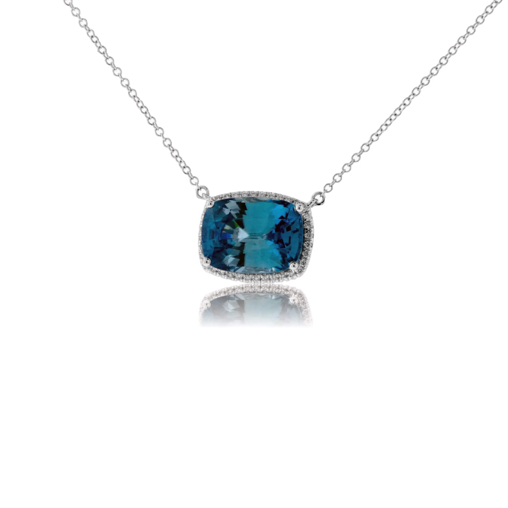 Stunningly Simple Blue Zircon and Diamond Halo Pendant