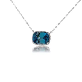 Stunningly Simple Blue Zircon and Diamond Halo Pendant