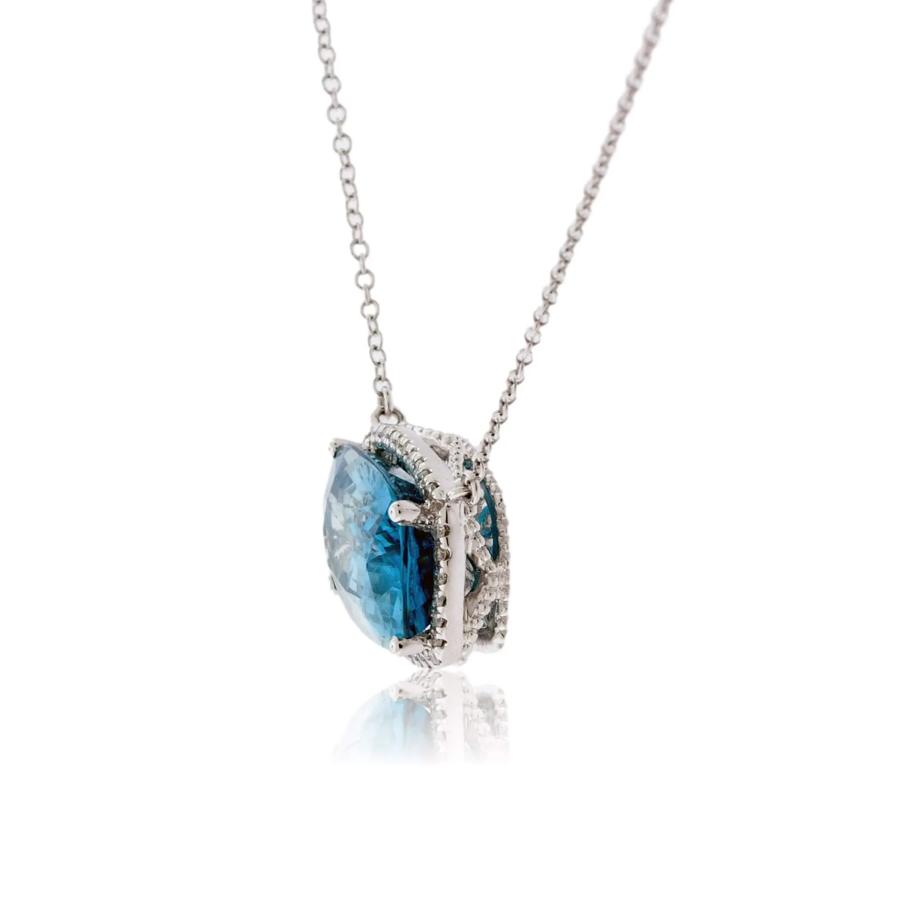Stunningly Simple Blue Zircon and Diamond Halo Pendant